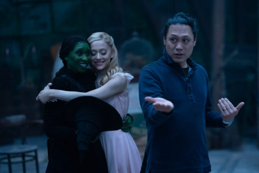 Cynthia Erivo is Elphaba, Ariana Grande is Glinda and Director Jon M. Chu on the set of WICKED, from Universal Pictures