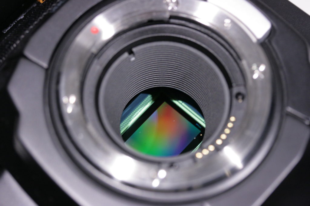 Sensor of a Blackmagic Ursa Mini camera, showing spectral colour effects from its tiny features